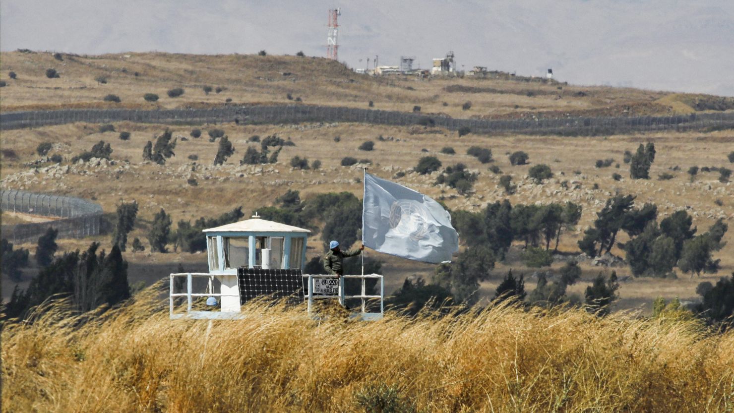 A UN peacekeeper stands on duty at an outpost of the United Nations Disengagement Observer Force (UNDOF) buffer zone between Syria and the Israeli-occupied Golan Heights on August 11, 2020.