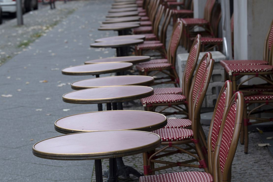 Empty tables and chairs stand in front of a restaurant in Berlin. Germany is under partial lockdown in November.