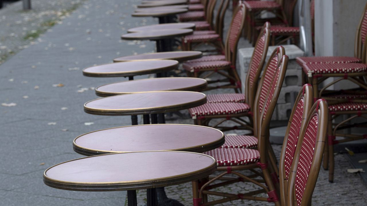 Empty tables and chairs stand in front of a restaurant in Berlin. Germany is under partial lockdown in November.