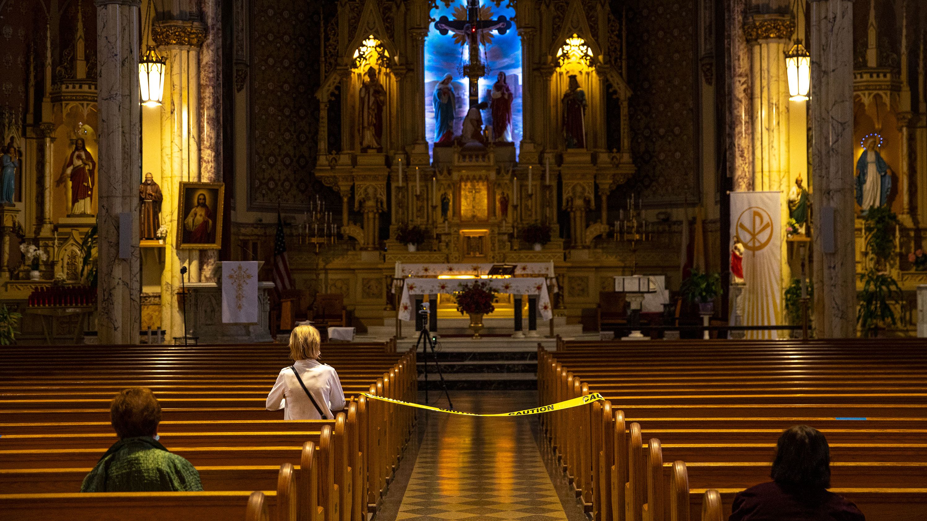 Churchgoers pray keeping social distancing at the St. Stanislaus Kostka Catholic Church in Brooklyn, New York, on June 11, 2020. 