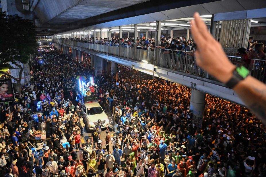 A truck carrying pro-democracy protesters with a loudspeaker system moves through the crowd at an anti-government rally in Bangkok, Thailand, on Wednesday, November 18.