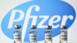 An illustration picture shows vials with Covid-19 Vaccine stickers attached, with the logo of US pharmaceutical company Pfizer, on November 17, 2020. (Photo by JUSTIN TALLIS / AFP) (Photo by JUSTIN TALLIS/AFP via Getty Images)