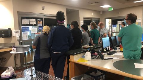 Hospital staff watches as he plays.