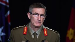 Chief of the Australian Defence Force Gen. Angus Campbell delivers the findings from the Inspector-General of the Australian Defence Force Afghanistan Inquiry, in Canberra, Thursday, Nov. 19, 2020. A shocking report into war crimes by elite Australian troops has found evidence that 25 soldiers unlawfully killed 39 Afghan prisoners, farmers and civilians. (Mick Tsikas/Pool Photo via AP)