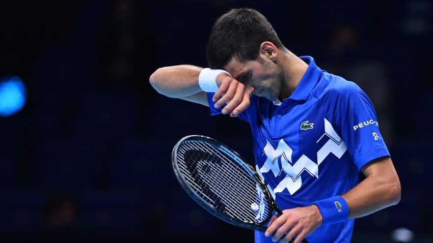 Serbia's Novak Djokovic reacts during his match agaainst Russia's Daniil Medvedev during their men's singles round-robin match on day four of the ATP World Tour Finals tennis tournament at the O2 Arena in London on November 18, 2020. (Photo by Glyn KIRK / AFP) (Photo by GLYN KIRK/AFP via Getty Images)
