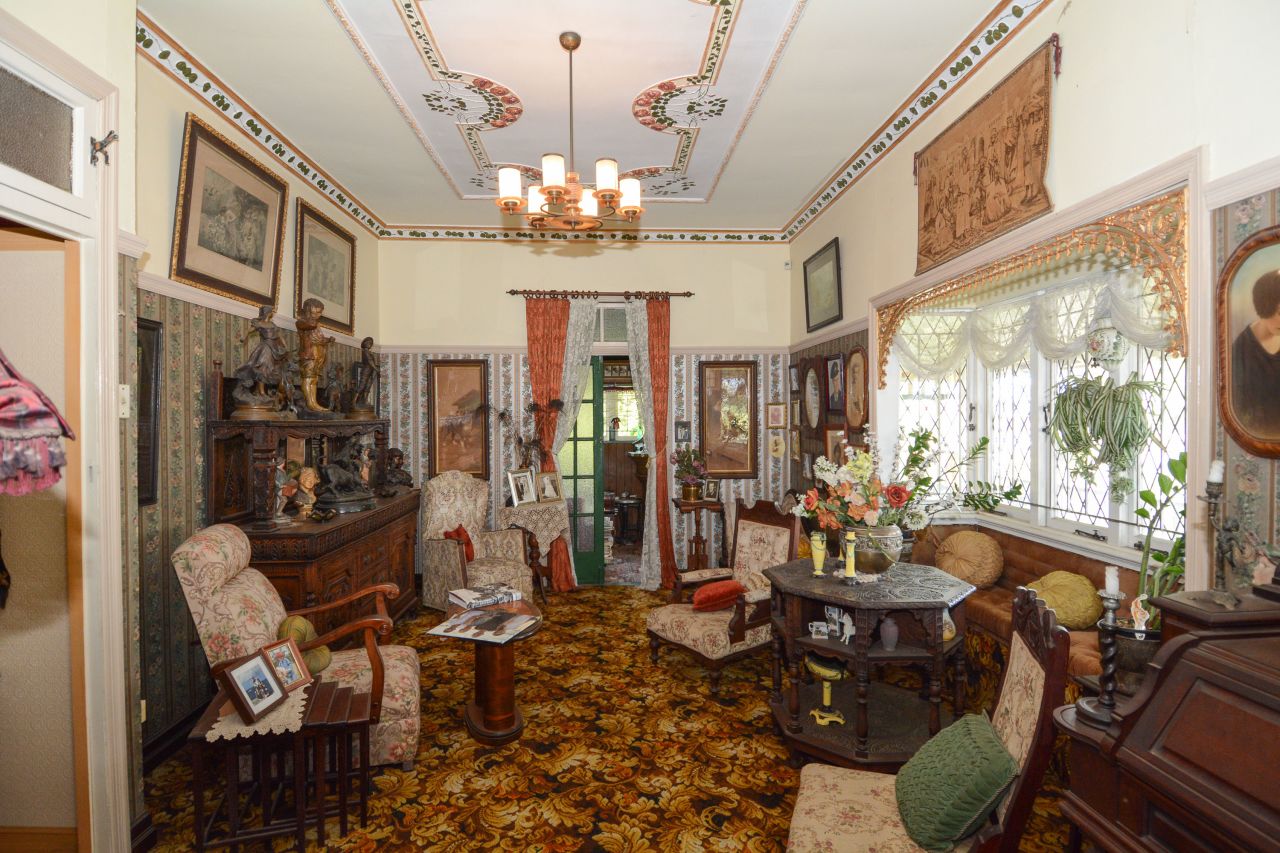 The formal lounge seemed to have been frozen in time. In the corner was an old Mason & Hamlin pump organ. Dean Brough said it was another one of his father's impulse purchases, this time from a car show.