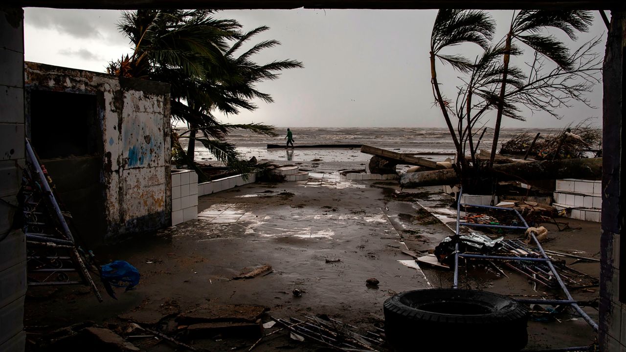 A man walks on the beach after the passage of Hurricane Iota in Bilwi, Nicaragua on November 17, 2020. 