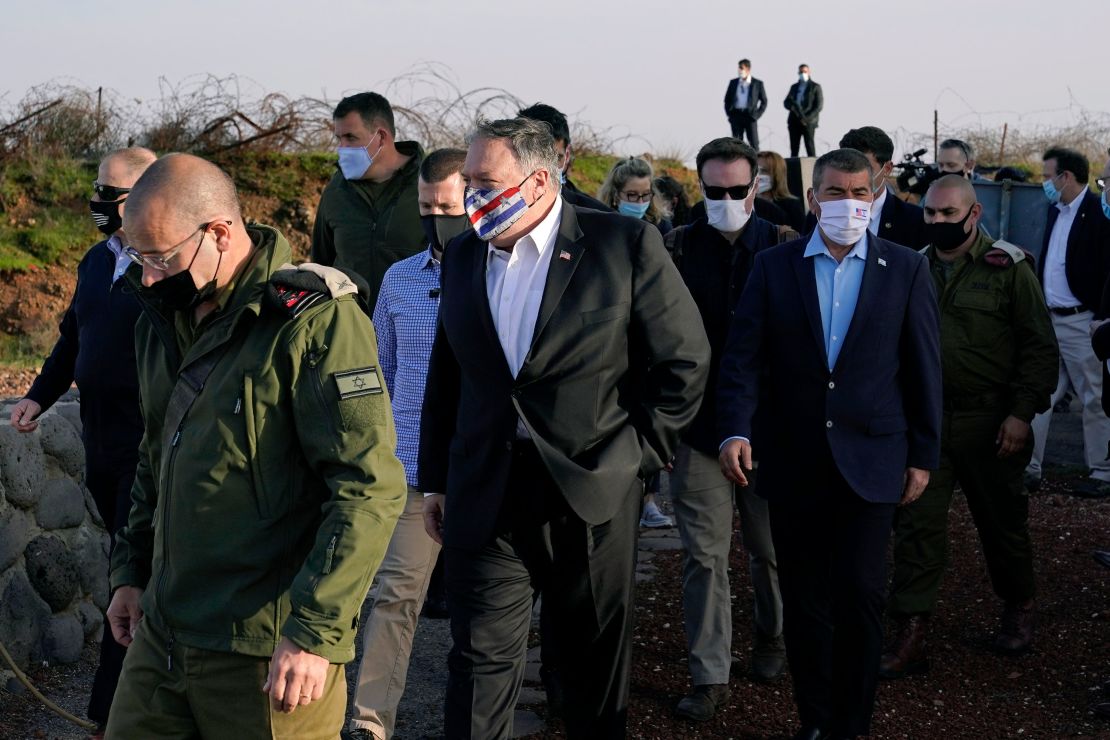 Pompeo, center, arrives for a security briefing on Mount Bental in the Golan Heights on November 19.