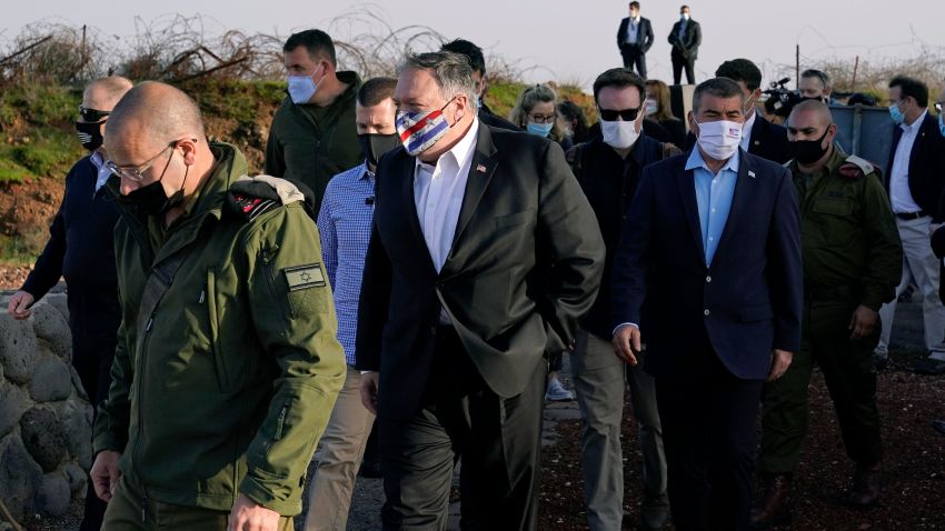 Secretary of State Mike Pompeo, center, arrives for a security briefing on Mount Bental in the Israeli-controlled Golan Heights, near the Israeli-Syrian border, Thursday, Nov. 19, 2020.