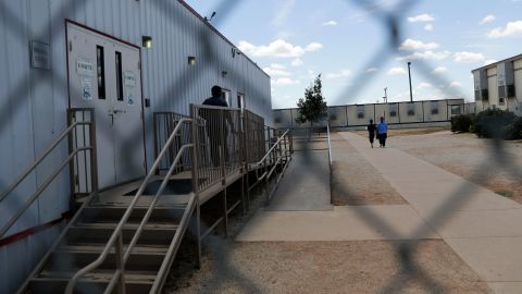 Detained immigrants walk outside the ICE South Texas Family Residential Center in August 2019. Two children detained at the facility are asking leaders to step in and stop their deportation.