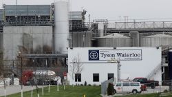 In this May 1, 2020, file photo, vehicles sit outside the Tyson Foods plant in Waterloo, Iowa. Civil rights attorney Tom Frerichs on Thursday June 25, 2020, filed a lawsuit on behalf of the estates of three Tyson Foods workers at its pork processing plant in Waterloo who died after contracting coronavirus. The lawsuit alleges the company knowingly put employees at risk during an outbreak and lied to keep them on the job. (AP Photo/Charlie Neibergall)