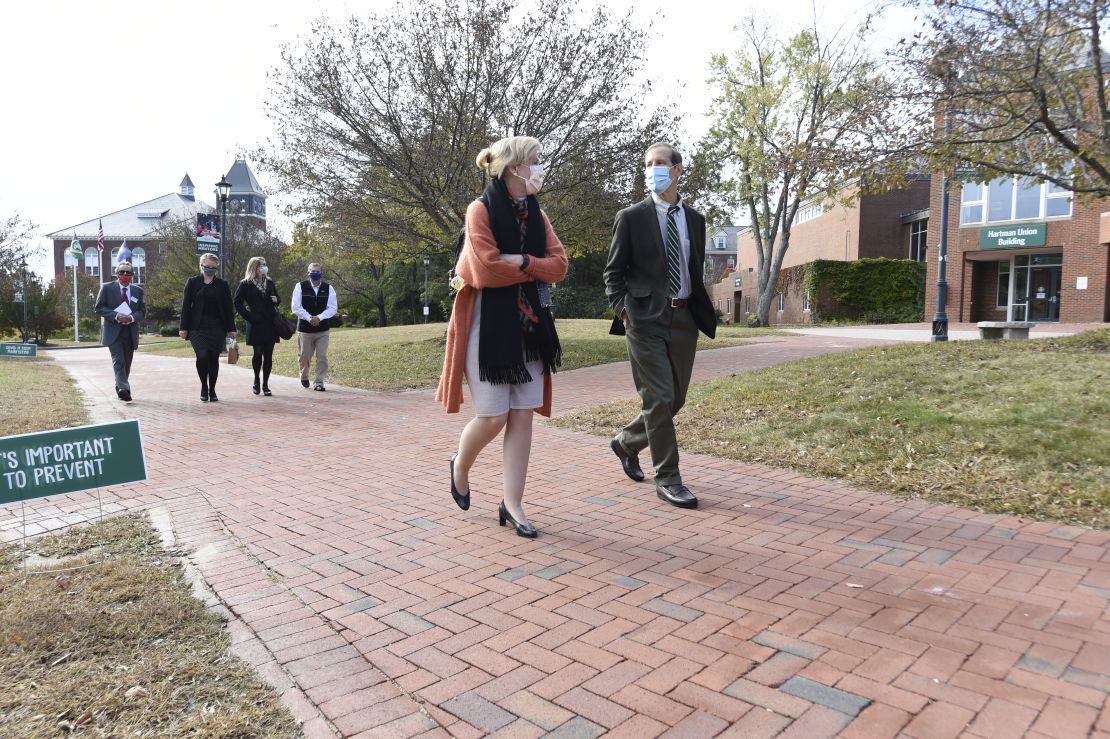 Deborah Birx walks on campus with her brother, Donald, the president of Plymouth State University.