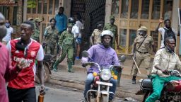 Ugandan security forces patrol on a street in Kampala, Uganda Thursday, Nov. 19, 2020. The death toll from protests over the latest arrest of Ugandan opposition presidential hopeful and musician Bobi Wine has risen to 16, police said Thursday, as a second day of demonstrations continued in the country's worst unrest in a decade. (AP Photo)