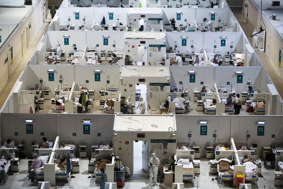 Medical workers and patients are seen November 18 at a temporary hospital that was set up for coronavirus patients at the Krylatskoye Ice Palace in Moscow. Russia said that as of November 16, more than 33,000 people in the country had died of Covid-19. But that number is disputed by critics who say the Kremlin is underreporting the numbers.