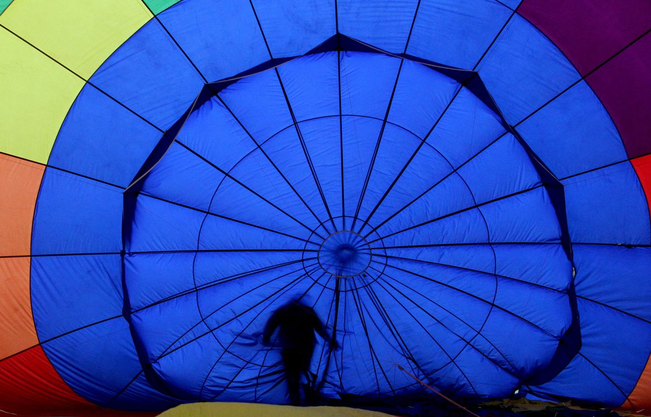 A pilot prepares to fly during the International Hot Air Balloon festival in Leon, Mexico, on Saturday, November 14.