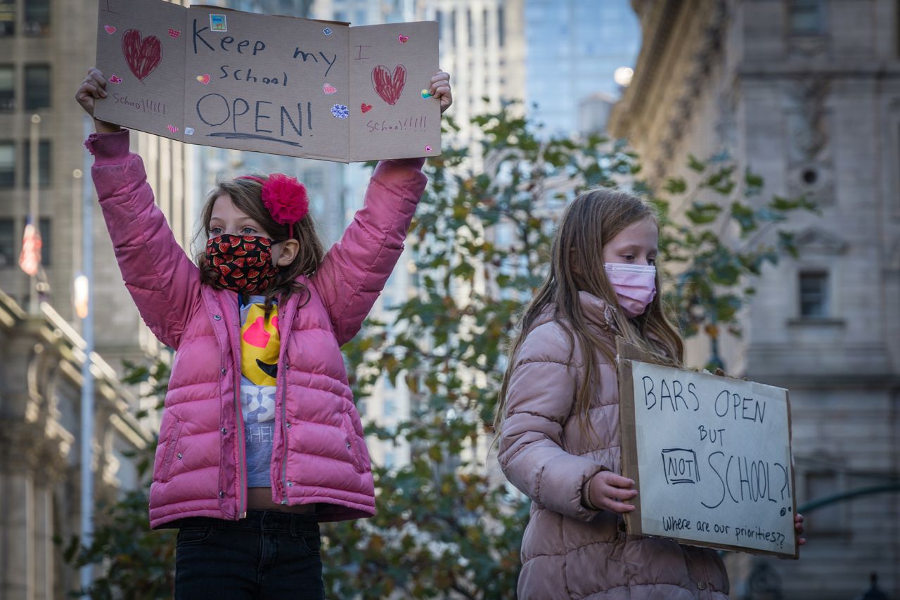 New York City students protest to keep schools open on November 14. Mayor Bill de Blasio made the decision to close down the city's public school buildings starting on November 19, after the city's 7-day average reached the 3% positive-testing-rate threshold.