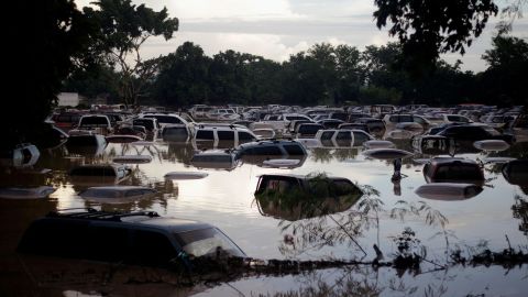 Vehicles are submerged at a plot flooded by the Chamelecon River due to heavy rain caused by Storm Iota, in La Lima, Honduras November 19, 2020. REUTERS/Jorge Cabrera     TPX IMAGES OF THE DAY