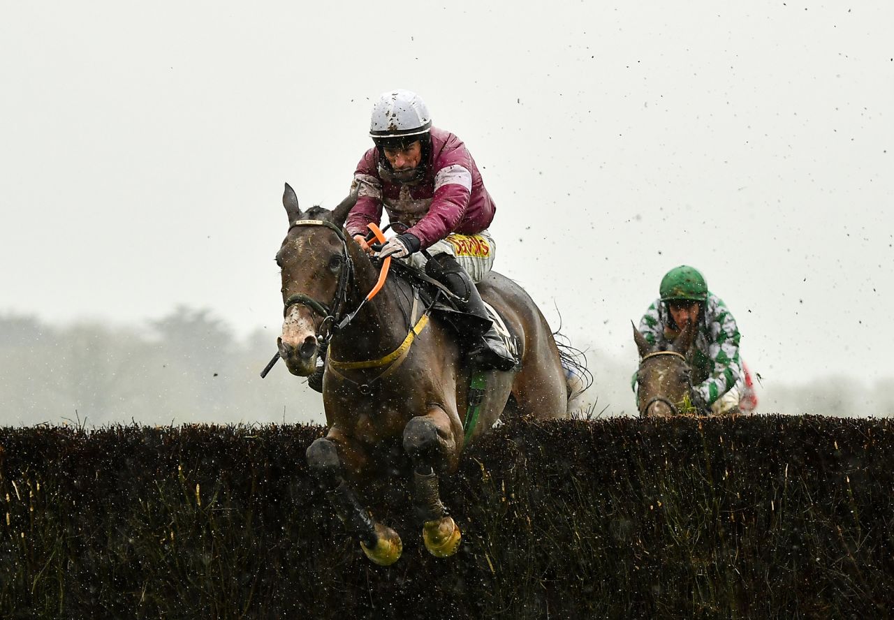 Sean Flanagan and his horse Daly Tiger jump their last hurdle before winning the Alanna Homes Handicap Steeplechase at Punchestown Racecourse in Kildare, Ireland, on Saturday, November 14.