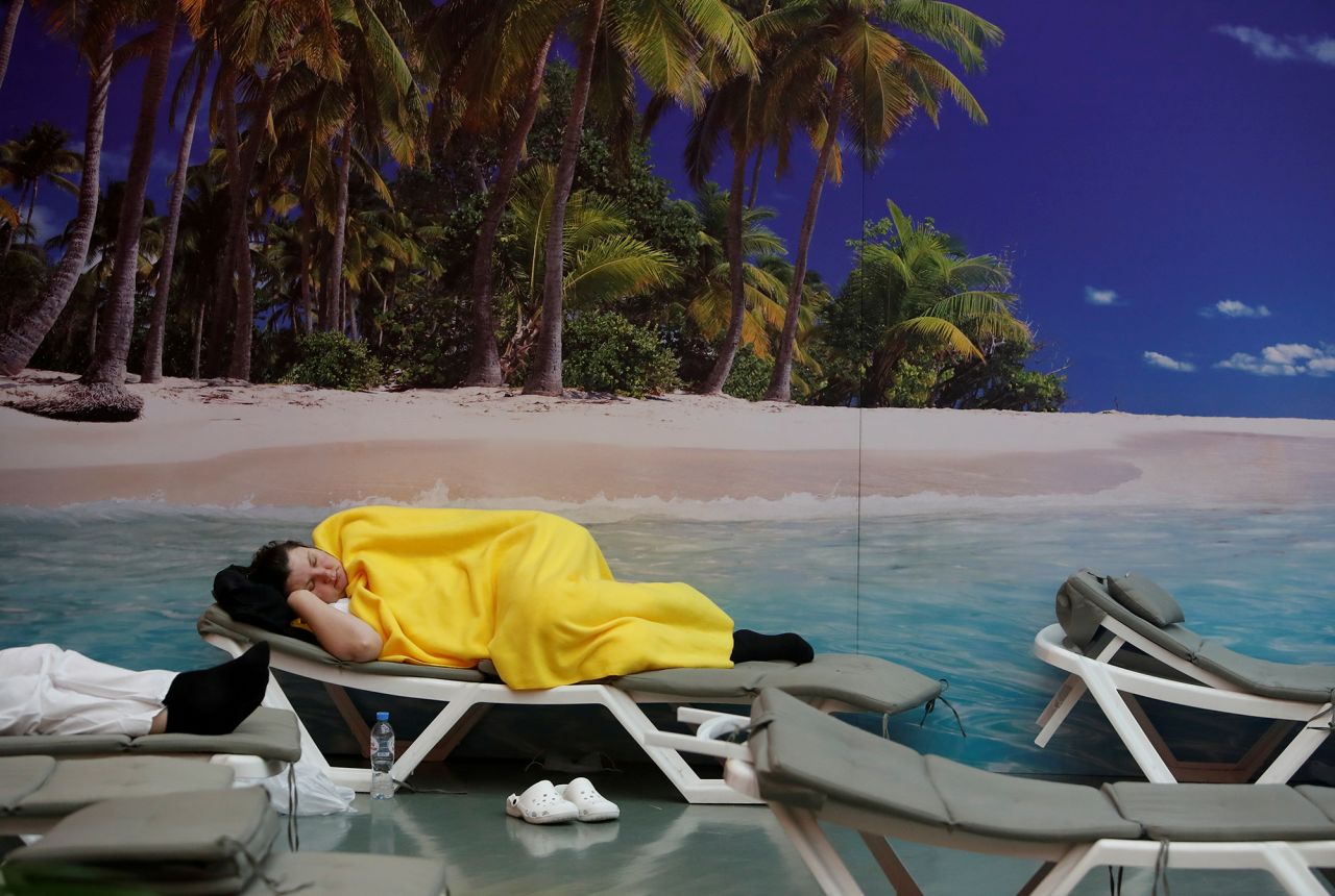 A medical worker rests in a relaxation room at the temporary hospital in the Exhibition of Achievements of National Economy in Moscow on Tuesday, November 17.