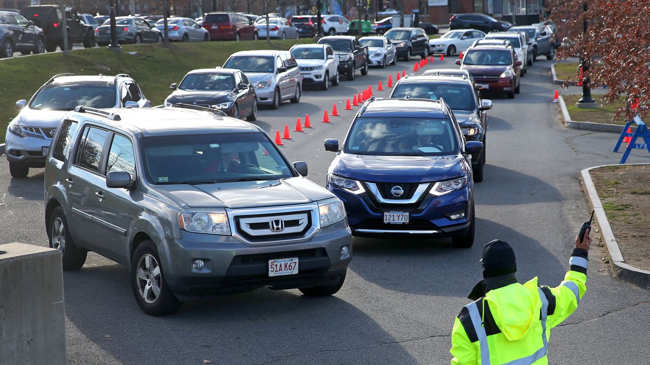 Drivers wait in long lines for drive-through testing outside the Lawrence General Hospital in Lawrence, Massachusetts, on Tuesday.