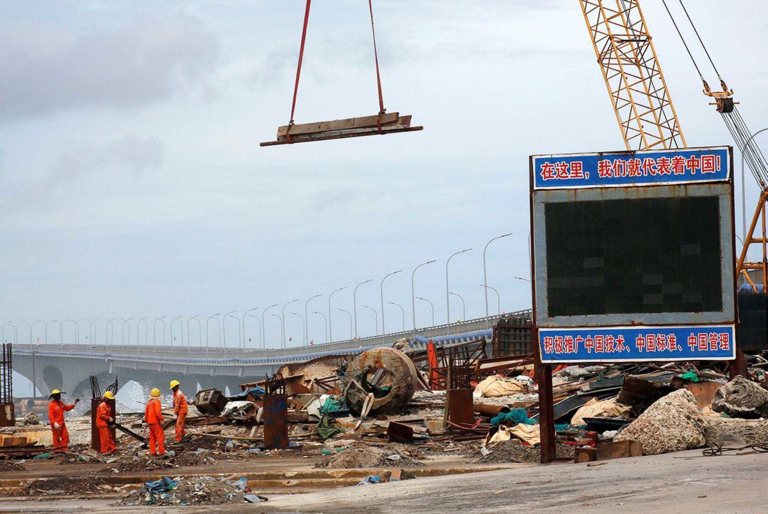 A signboard at the construction site of the China-Maldives Friendship Bridge reads: "Here, we represent China!" 