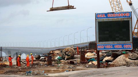 A signboard at the construction site of the China-Maldives Friendship Bridge reads: "Here, we represent China!" 