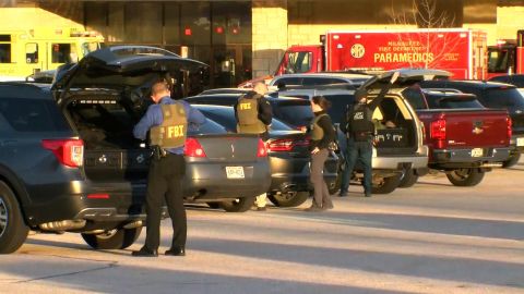Police officers respond to the shooting at Mayfair Mall in Wauwatosa, Wisconsin.
