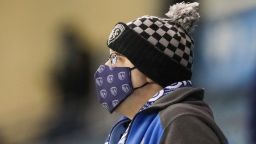 KANSAS CITY, KS - OCTOBER 24: A Sporting Kansas City fan wears a mask and tries to stay warm on a cold night on October 24, 2020 at Children's Mercy Park in Kansas City, KS.  (Photo by Scott Winters/Icon Sportswire via Getty Images)
