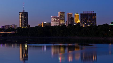 A dusk view of the Tulsa skyline, reflected in the Arkansas River.