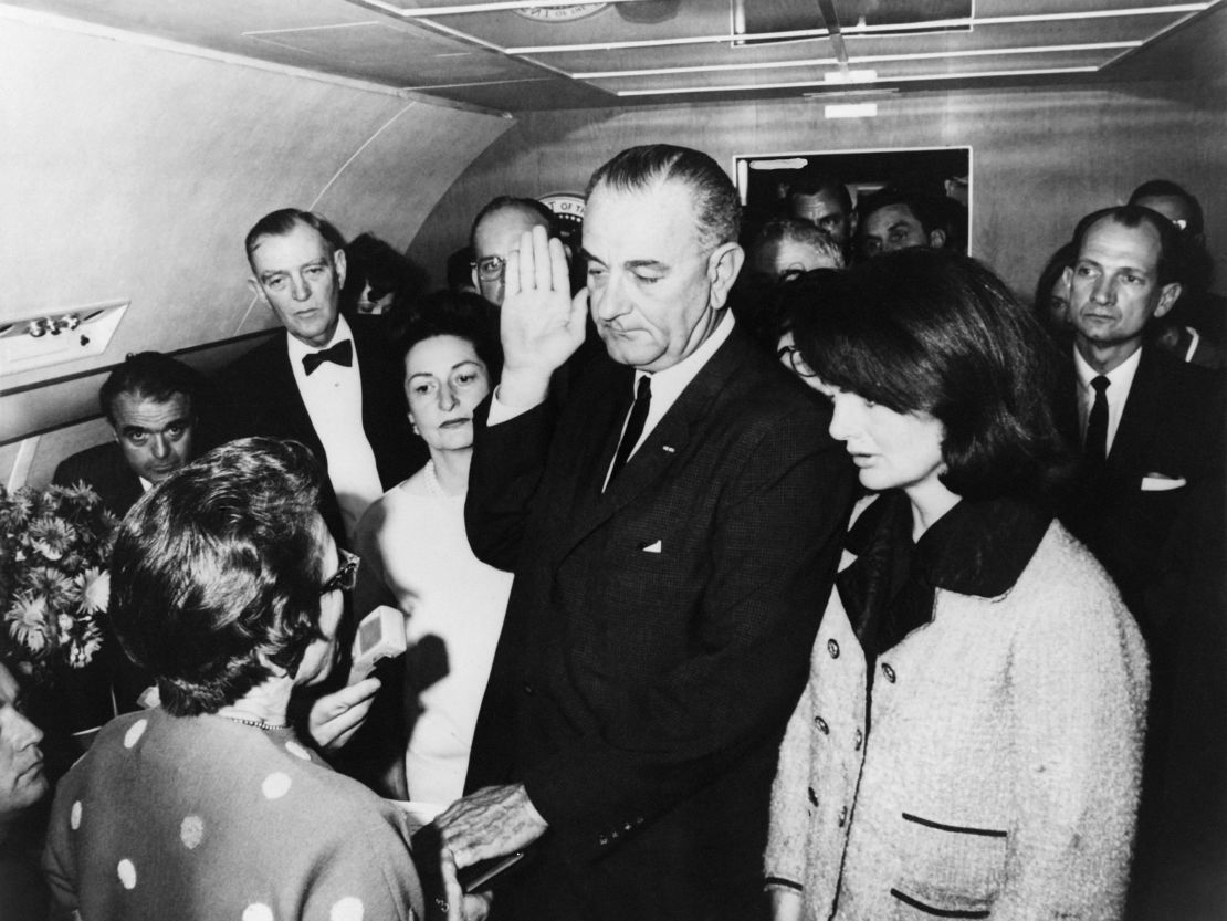 Lyndon Johnson takes the oath of office aboard Air Force One on November 22, 1963.