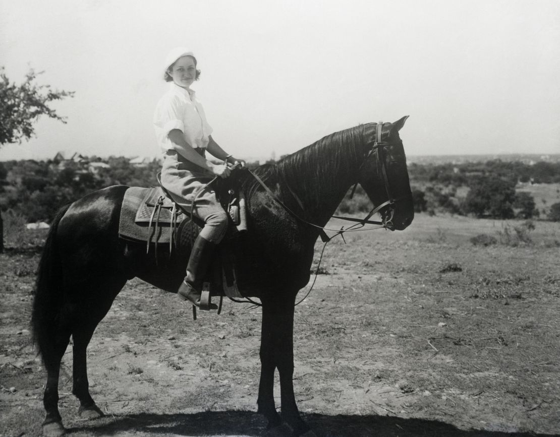 Lady Bird Johnson rides a horse on the Johnson family ranch in Texas in 1963.