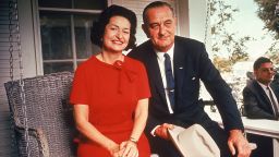 President Lyndon Johnson (R) sitting on proch swing w. wife Claudia (Ladybird) on morning following his landslide election win.  (Photo by John Dominis/The LIFE Picture Collection via Getty Images)