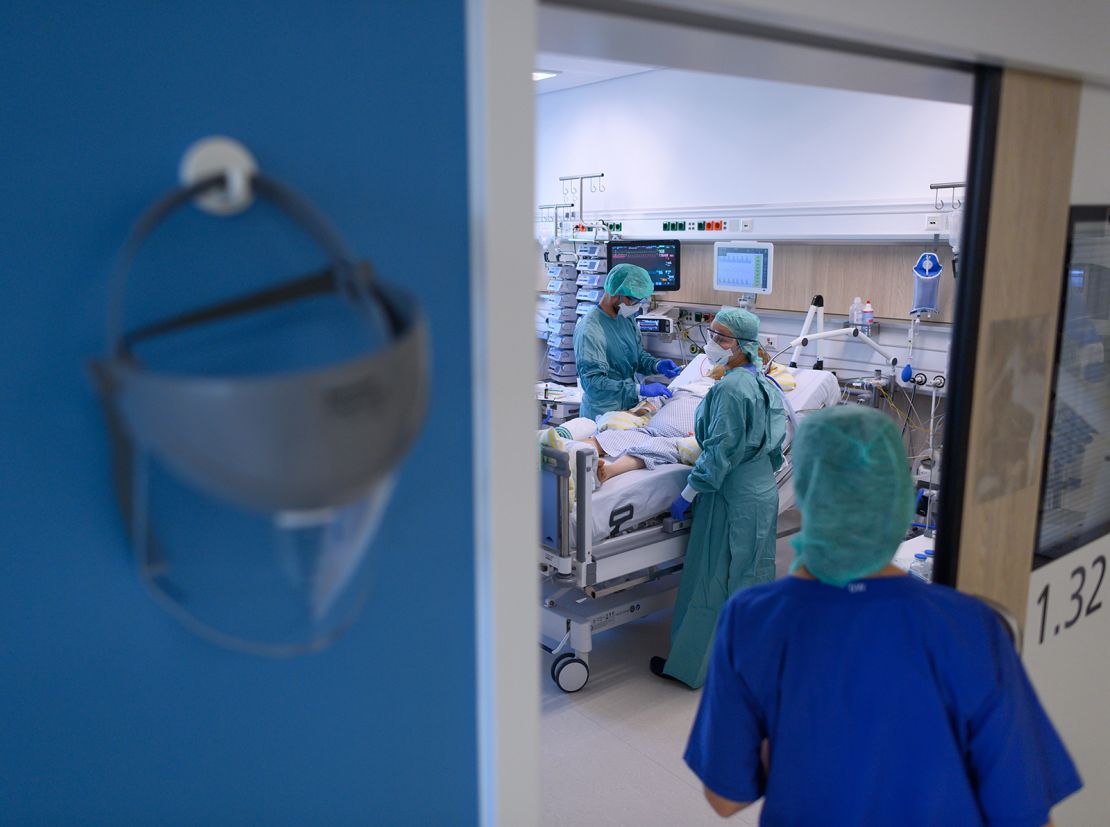 Nurses look after patients in the coronavirus intensive care unit of the University Hospital Dresden, November 13, 2020.