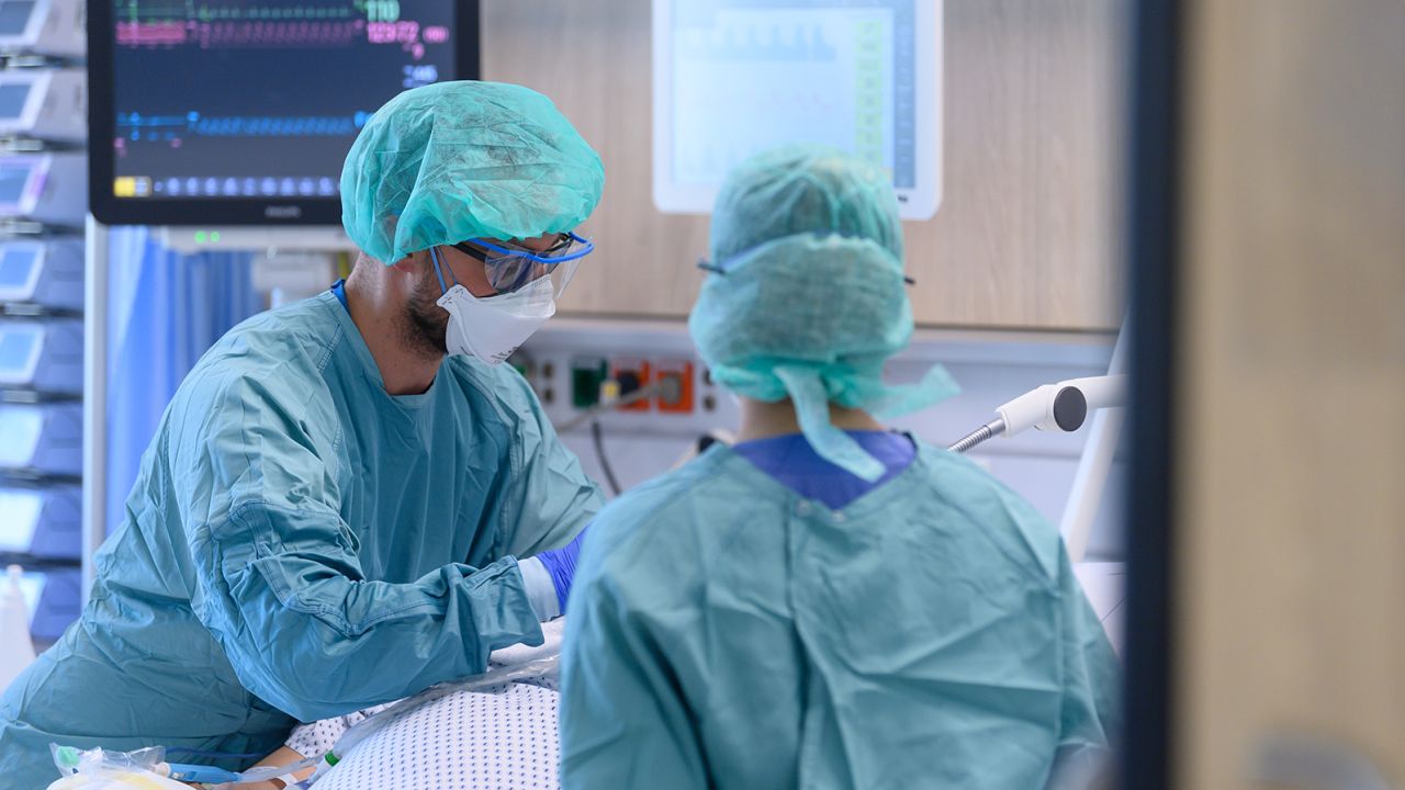 Nurses tend to patients in the coronavirus intensive care unit of the University Hospital Dresden, November 13, 2020.