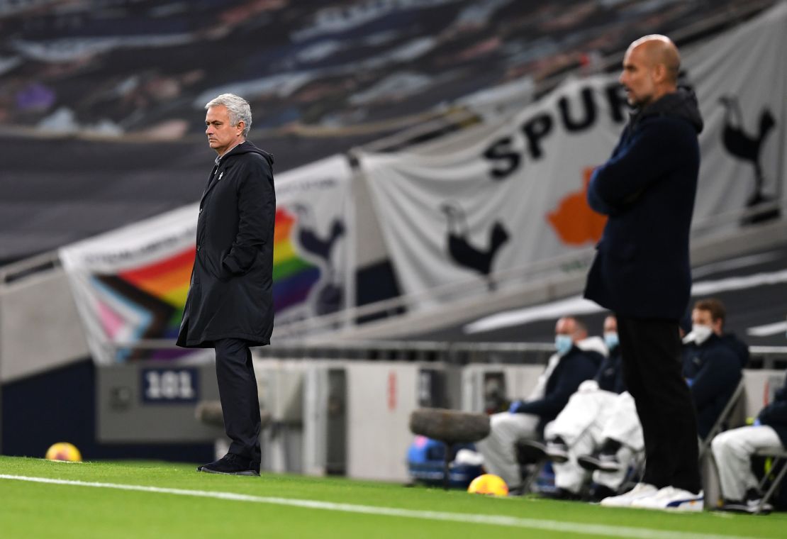 Mourinho and Guardiola look on during the match between Tottenham Hotspur and Manchester City.