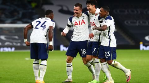 Lo Celso celebrates with his teammates after scoring his team's second goal against Manchester City.