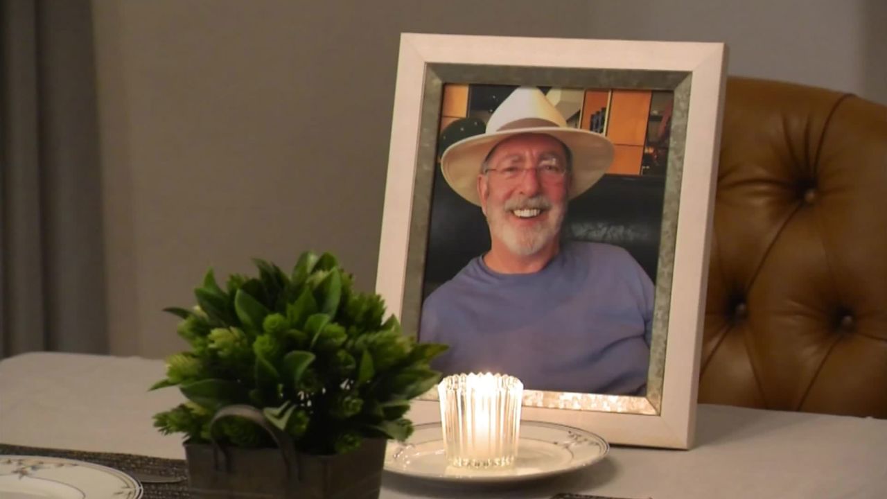 A photo of Lonnie and a candle stood in front his empty chair during their Thanksgiving dinner this year. 
