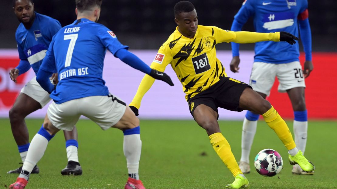 Moukoko turns with the ball against Hertha Berlin. 