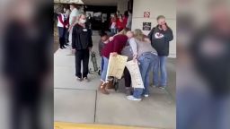 Slater being hugged by his family when he finally left the hospital. 