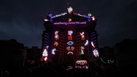 The exterior of the Tate Britain art gallery in London is lit up by neon lights to mark Diwali on November 14.