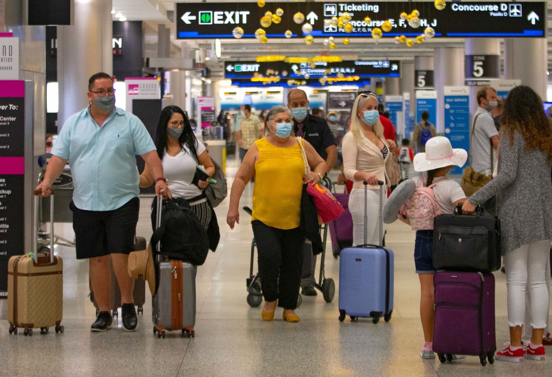 Miami International Airport was busy Sunday, three days after the CDC pleaded for Americans to not travel for Thanksgiving.