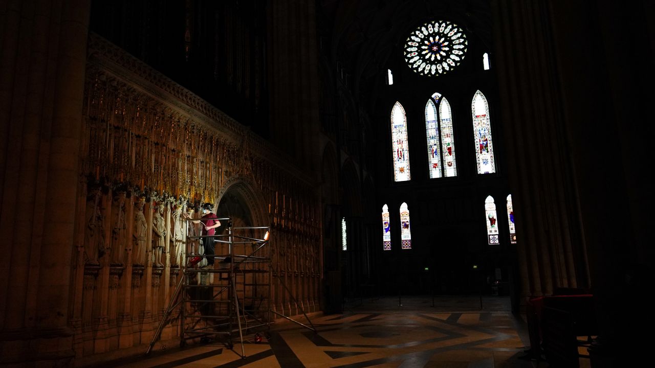 <strong>York, UK: </strong>A conservator carries out restoration work on the pulpitum -- a large ornate screen -- at York Minster cathedral, as part of a once-in-a-century project to refurbish the Grand Organ. 