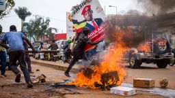 A supporter of Bobi Wine, carries his poster during a protest against his arrest in Kampala, Uganda, on November 18, 2020.