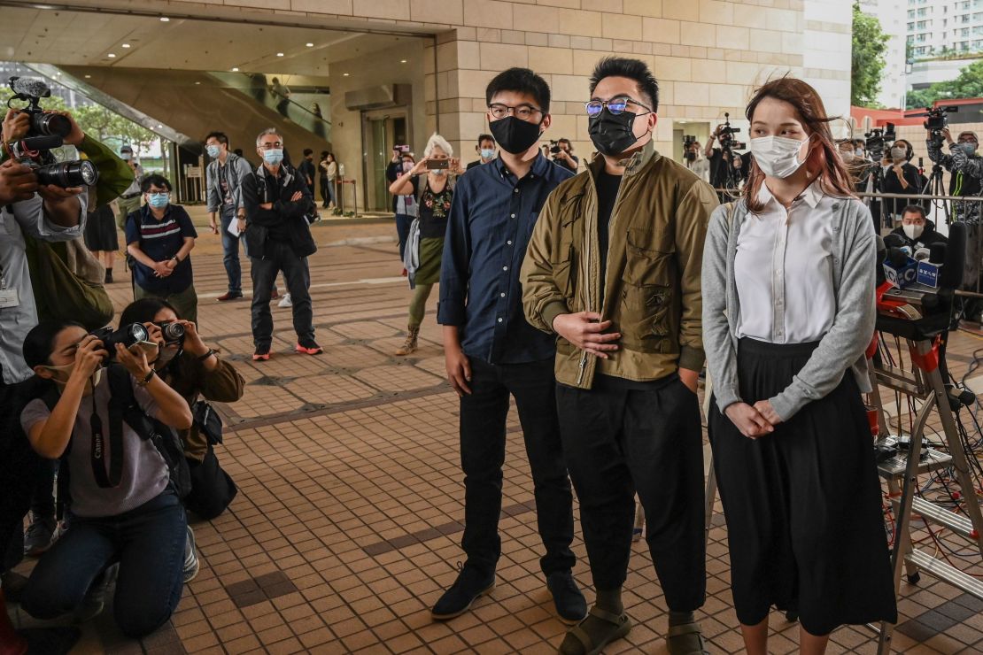 Joshua Wong, Ivan Lam and Agnes Chow arrive for their trial at West Kowloon Magistrates Court in Hong Kong on November 23, 2020.