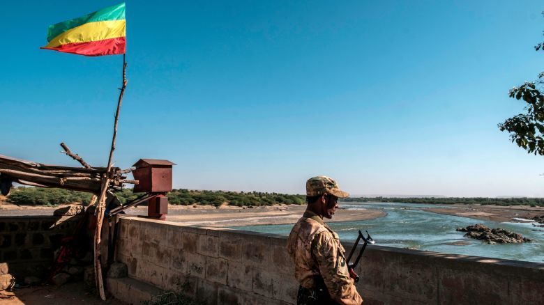 A member of the Amhara Special Forces watches on at the border crossing with Eritrea where an Imperial Ethiopian flag waves, in Humera, Ethiopia, on November 22, 2020. 