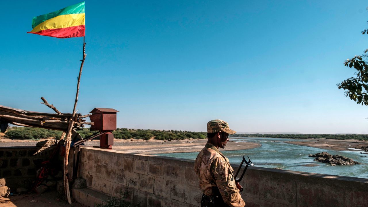A member of the Amhara Special Forces watches on at the border crossing with Eritrea where an Imperial Ethiopian flag waves, in Humera, Ethiopia, on November 22.