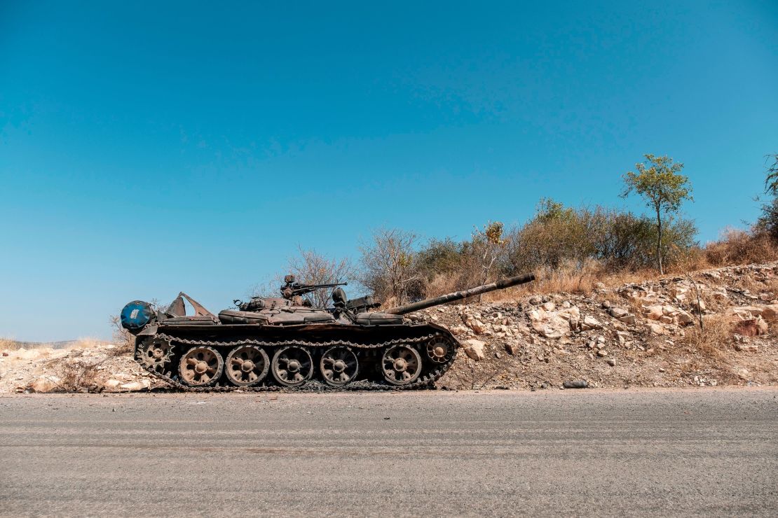 A damaged tank stands abandoned on a road near Humera, Ethiopia, on November 22, 2020