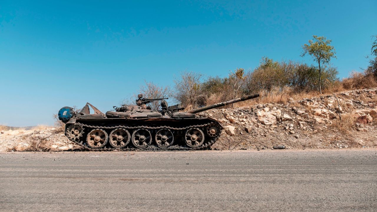 A damaged tank stands abandoned on a road near Humera, Ethiopia, on November 22, 2020