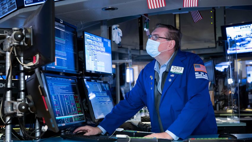 Specialist Patrick King works at the New York Stock Exchange on Monday, Nov. 23, 2020. Stocks rose in early trading Monday after investors received several pieces of encouraging news on COVID-19 vaccines and treatments, tempering concerns over rising virus cases and business restrictions. (Nicole Pereira/New York Stock Exchange via AP)