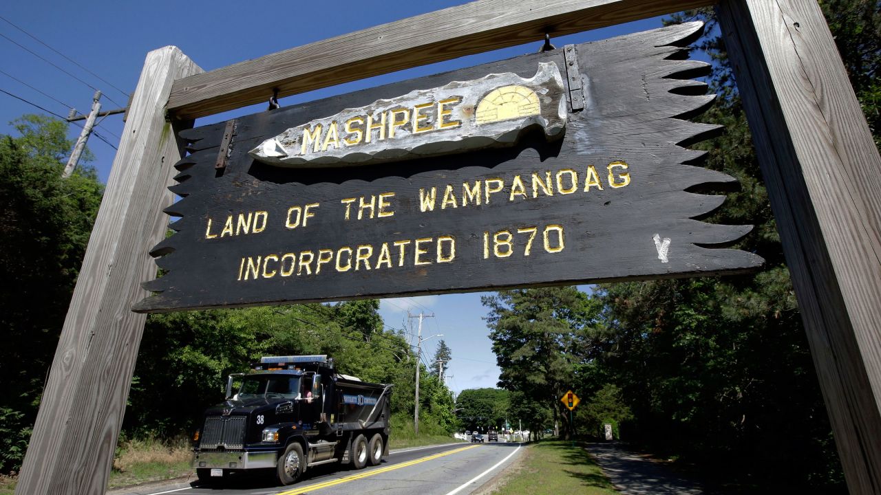 A wooden sign advises motorists of the location of Mashpee Wampanoag Tribal lands in Massachusetts. 